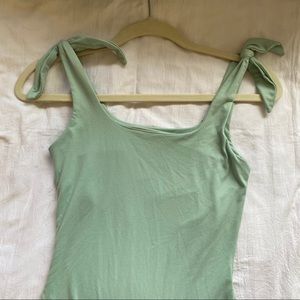 Green tie body suit